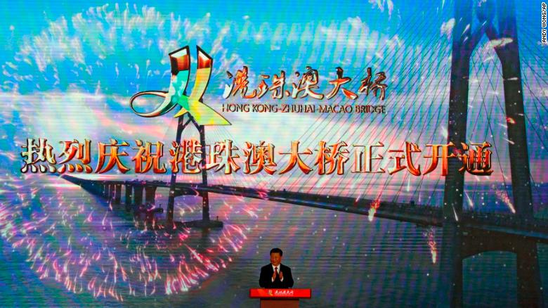 Chinese President Xi Jinping applauds on stage after official opening of the China-Zhuhai-Macau-Hong Kong Bridge, October 23, 2018.